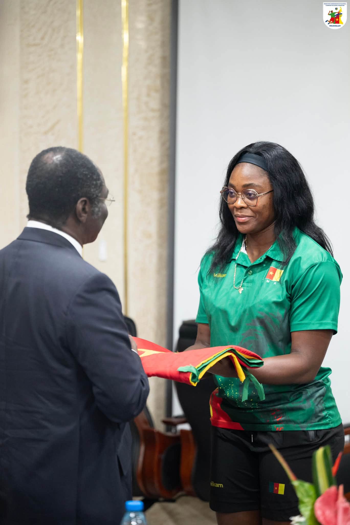 Handing over of the national flag to Cameroon's captain